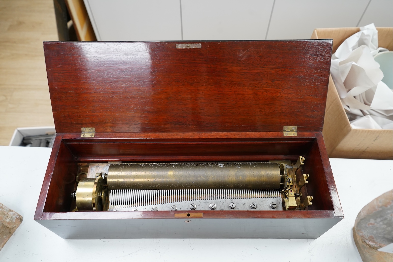 A 19th century Swiss rosewood and marquetry cased cylinder music box, by Nicole Freres, with engraved serial number 11039, the cylinder is 32.5cm long, the case; 51cm wide, 15cm high, 17cm deep